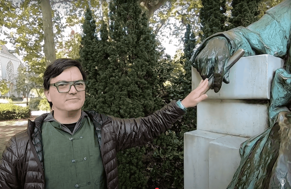 Forrest Mallard with Statue of Anonymous Budapest